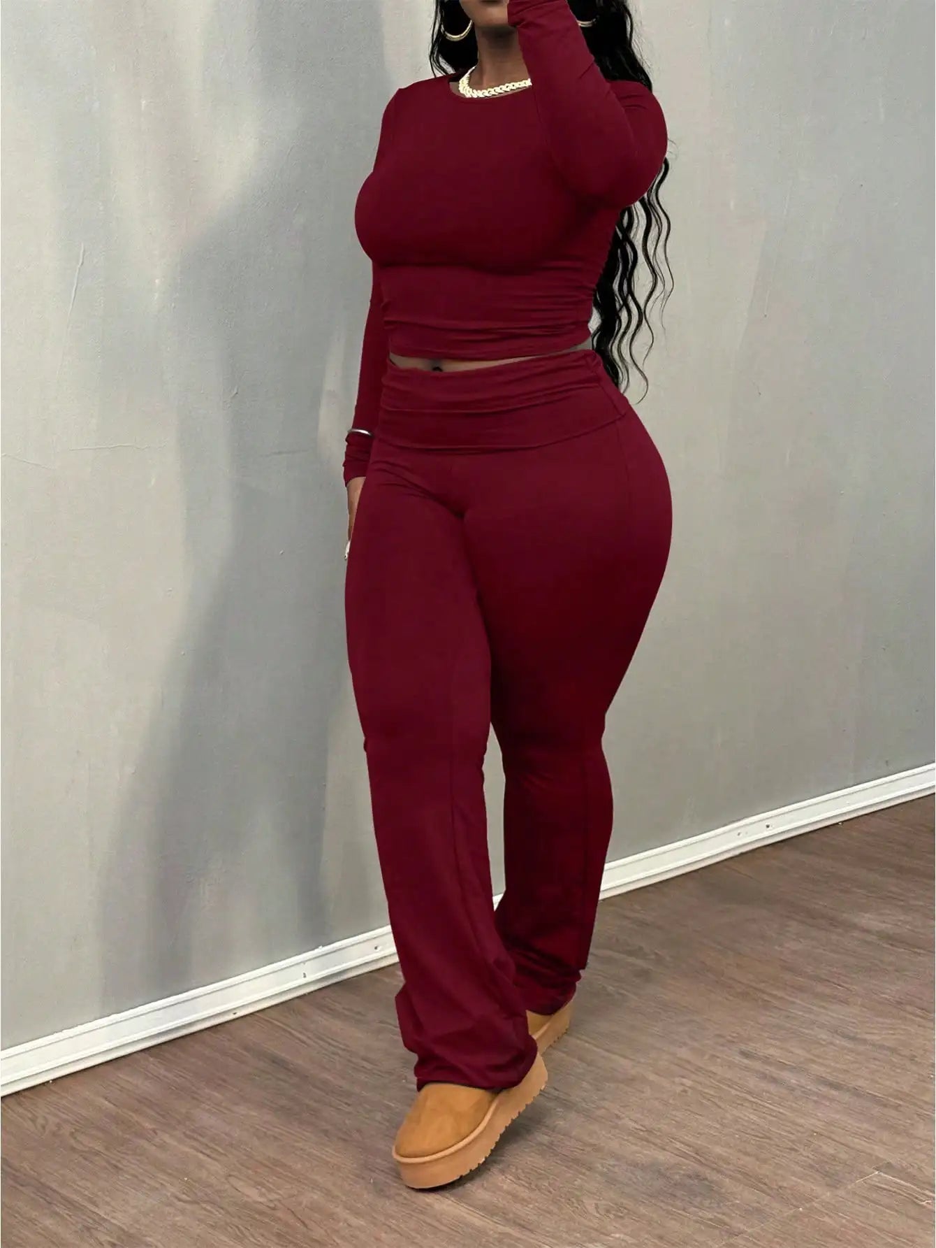 A Wine Red Long-sleeved Crop Top and Flared Pants Collection for Women - A Fashionable and Comfortable Sportswear Set for Ladies