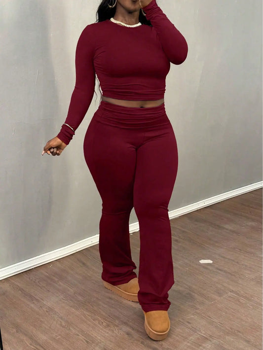 A Wine Red Long-sleeved Crop Top and Flared Pants Collection for Women - A Fashionable and Comfortable Sportswear Set for Ladies